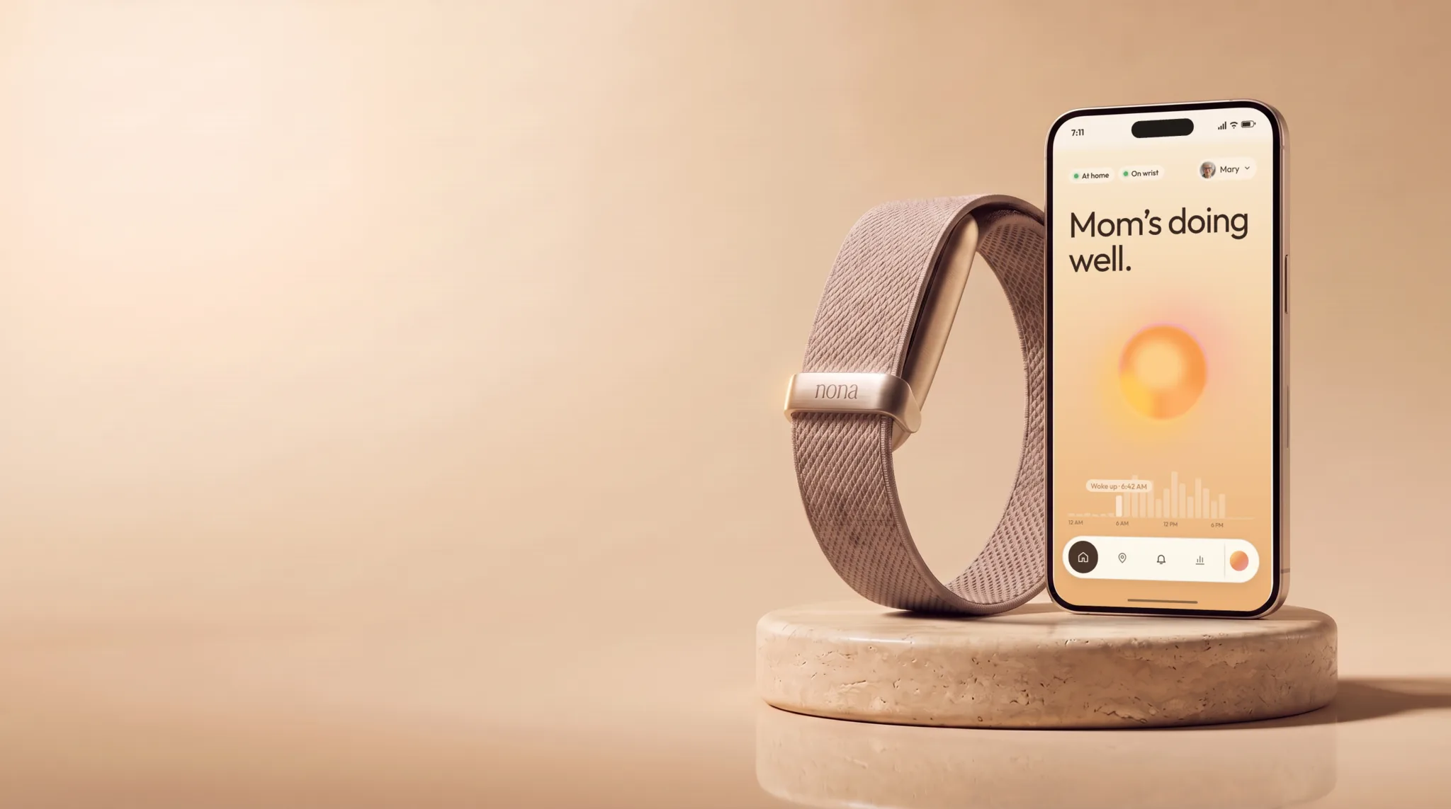 The Nona Air Wearable on its woven band beside a phone showing the Nona app, on a stone pedestal